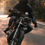 Man on a motorcycle during the summer.