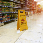 Wet floor sign at a grocery store.
