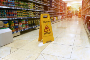 Wet floor sign at a grocery store.
