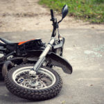 Motorcycle on the ground after accident.