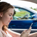 woman texting and driving